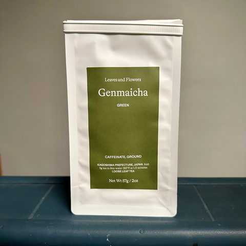 Tea package labeled 'Genmaicha' on a gray surface