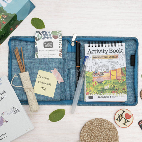 Children's activity book and stationery items on a white surface