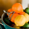 Fruit bowl with oranges, lemons, and limes on a bar counter