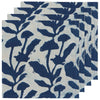 Set of four blue floral-patterned placemats on a white background